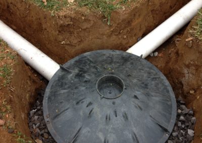 Dry Well - Drains surface water into the ground to eliminate pooling and standing water, or water from downspouts.